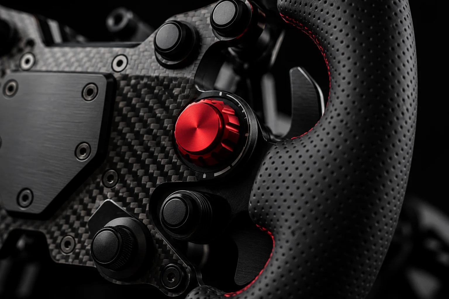 Détail du volant GRID : fibre de carbone et commande rouge